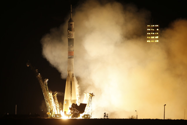 A Soyuz spacecraft carrying a new crew to the International Space Station, blasts off from Baikonur cosmodrome, Kazakhstan on 3/28/15.  The Russian rocket carries U.S. astronaut Scott Kelly, Russian cosmonauts Gennady Padalka, and Mikhail Korniyenko. (AP)