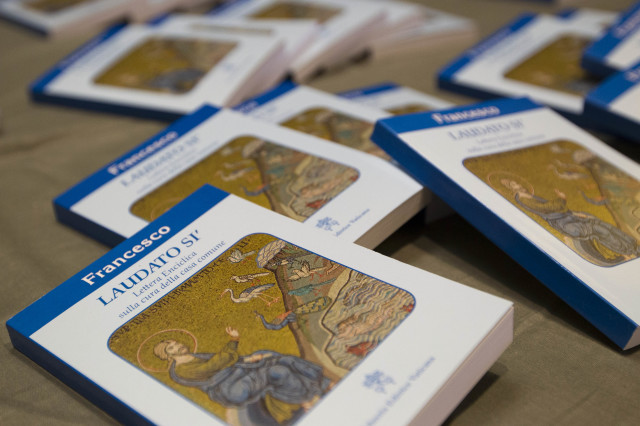Copies of Pope Francis' encyclical "Laudato Si," (Praise Be) are displayed prior to the start of a press conference, at the Vatican, Thursday, June 18, 2015. (AP)