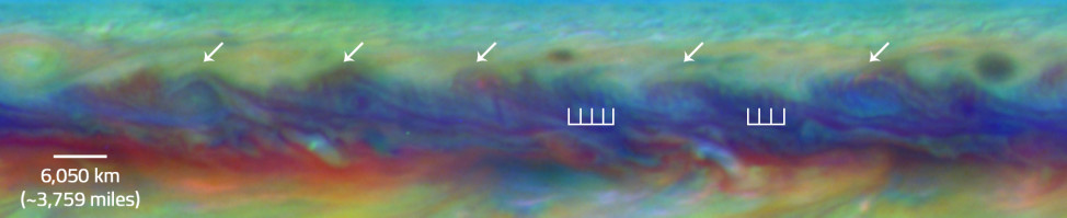 In Jupiter’s North Equatorial Belt, scientists spotted a rare wave that had been seen there only once before. It is similar to a wave that sometimes occurs in Earth’s atmosphere when cyclones are forming. This false-color close-up of Jupiter shows cyclones (arrows) and the wave (vertical lines). (NASA/ESA/Goddard/UCBerkeley/JPL-Caltech/STScI)
