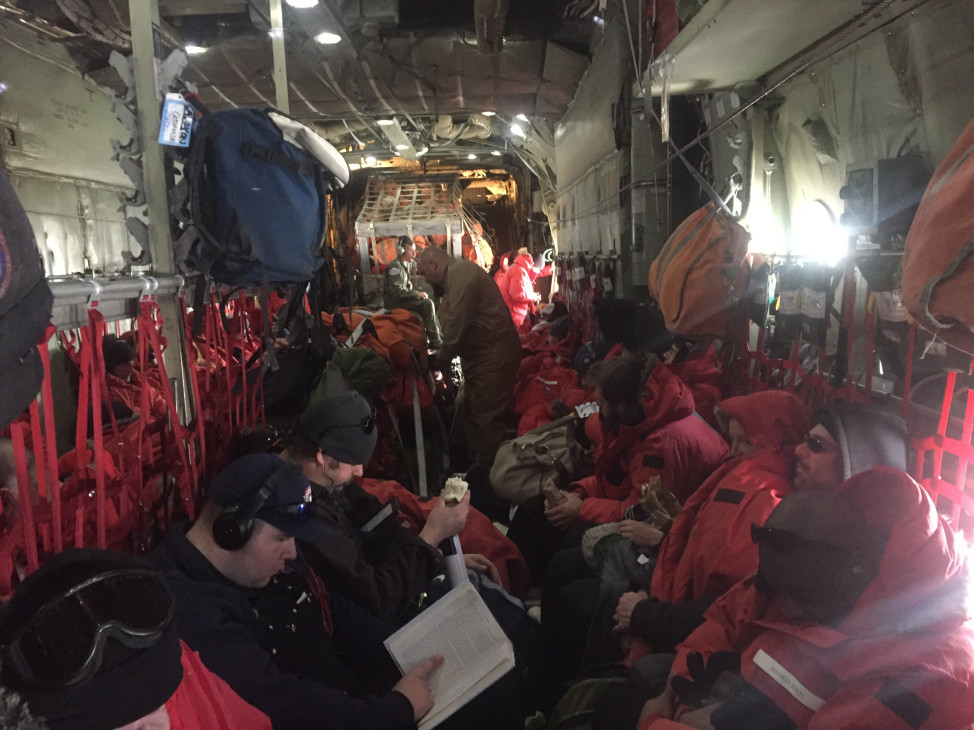Cramped conditions inside the main cabin of the LC-130 en route to the South Pole. (Photo by Refael Klein)