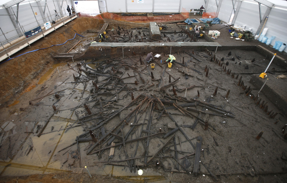 Scientists from the University of Cambridge Archaeological Unit, uncover remains of 3,000 year old wooden stilt houses on 1/12/16. The houses, said to be the best preserved Bronze Age dwellings ever found in Britain, were found preserved in silt, in a quarry. (Reuters)