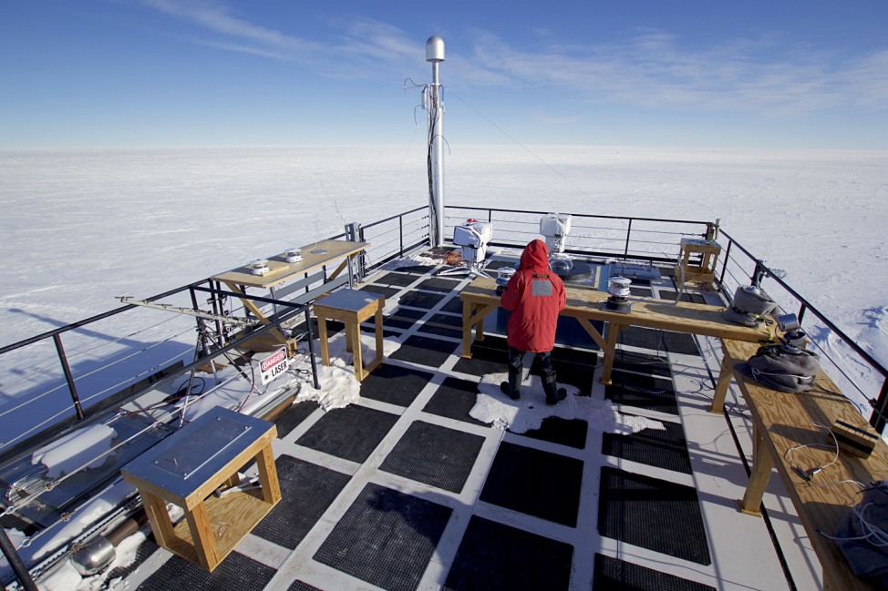 The author runs through daily checks on the solar radiation equipment at the Atmospheric Research Observatory (ARO) at the South Pole.  (Photo by Hunter Davis)