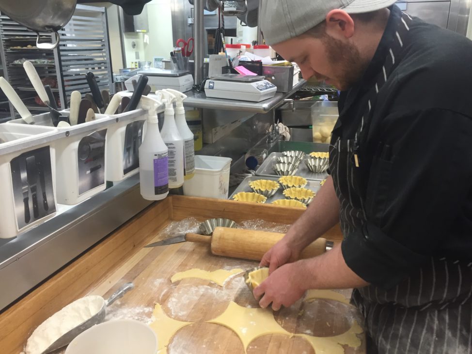 Busy at work, Chef KC Loosemore prepares shortbread pastry shells for his Peruvian Cocoa Nib Mousse Tarts. (Photo by Refael Klein)
