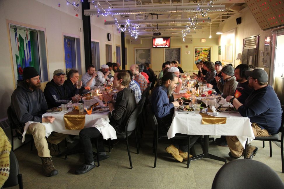 It's a rare sight to have the entire station in one room at the same time, but even the most introverted can't say no to the delectable treats that the kitchen prepares for Mid-Winter Dinner. (Photo by Refael Klein)