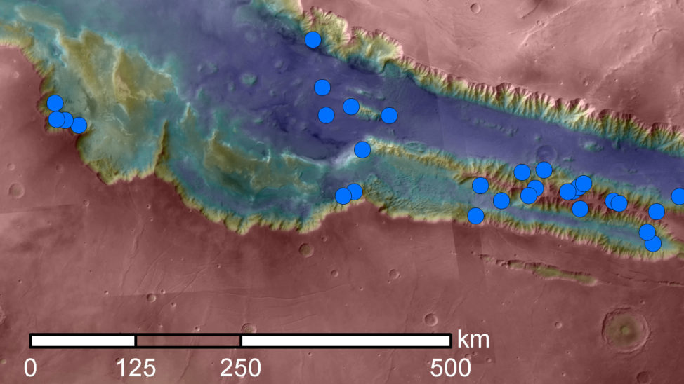 (Blue dots on this map indicate sites of recurring slope lineae (RSL) in part of the Valles Marineris canyon network on Mars. RSL are seasonal dark streaks that may be indicators of liquid water. The area mapped here has the highest density of known RSL on Mars. (NASA/JPL-Caltech/Univ. of Arizona)