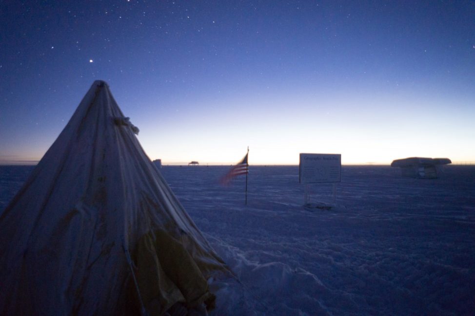 In celebration of the rising sun, a tent similar to the ones used on the original Scott expedition has been erected near the geographic pole. It is a good place to escape the wind and observe the receding night sky. (Photo: Max Peters)