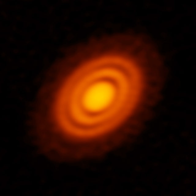 ALMA image of the protoplanetary disk surrounding the young star HD 163296 as seen in dust. New observations suggested that two planets, each about the size of Saturn, are in orbit around the star. (ALMA-ESO/NAOJ/NRAO/AUI/NSF)