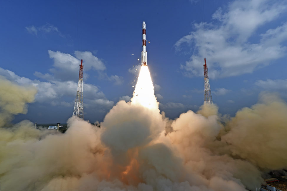 This photograph released by Indian Space Research Organization shows its polar satellite launch vehicle lifting off from a launch pad on 2/15/17. The Indian space agency sent a record 104 satellites on single rocket into space. (Indian Space Research Organization via AP)