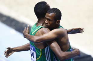 Ayanleh Souleiman (R) hugs runner-up Aman Wote of Ethiopia. Photo: Reuters