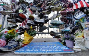 Running shoes memorial near finish line of 2013 Boston Marathon