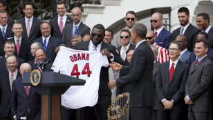 Red Sox slugger David "Big Papi" Ortiz presents a team jersey to President Obama. Photo: AP