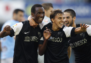 Fabrice Olinga with his Malaga teammates in 2012. Photo: Reuters