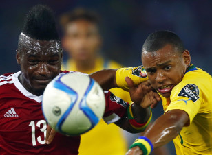 Thievy Bifouma of Congo is challenged by Gabon's Johann Obiang during their Group A soccer match of the 2015 African Cup of Nations in Bata