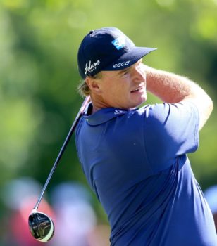 Ernie Els tees off on the seventh hole during the third round of the Quicken Loans National at the Congressional Country Club in Bethesda, Maryland. (photo by Bill Workinger / Voice of America)