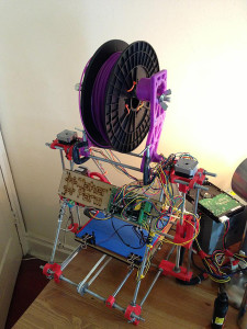 A finished, home-made RepRap self replicating printer. The purple parts were 3-D printed and added. (Dino Belsagic/VOA)