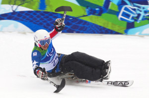 FILE - Alana Nichols of the U.S. celebrates her first place finish in the women's alpine skiing giant slalom sitting event at the 2010 Paralympic Winter Games in Whistler, British Columbia. (Reuters)