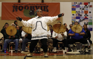 Morris Oviok performs with the Tikigiq Traditional Dancers from Point Hope, Alaska during the Potlach festival in the remote Inupiaq Eskimo village Noorvik, Alaska, Jan 25, 2010. (AP)