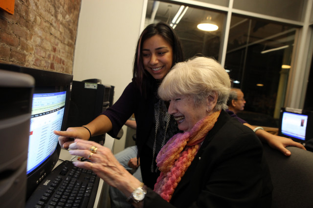 A Nov. 2012 file photo shows an instructor helping a student learn more about using email at the Senior Planet Exploration Center, the first of its kind for free technology education for older adults, NY. (OATS/Michael Kamber)