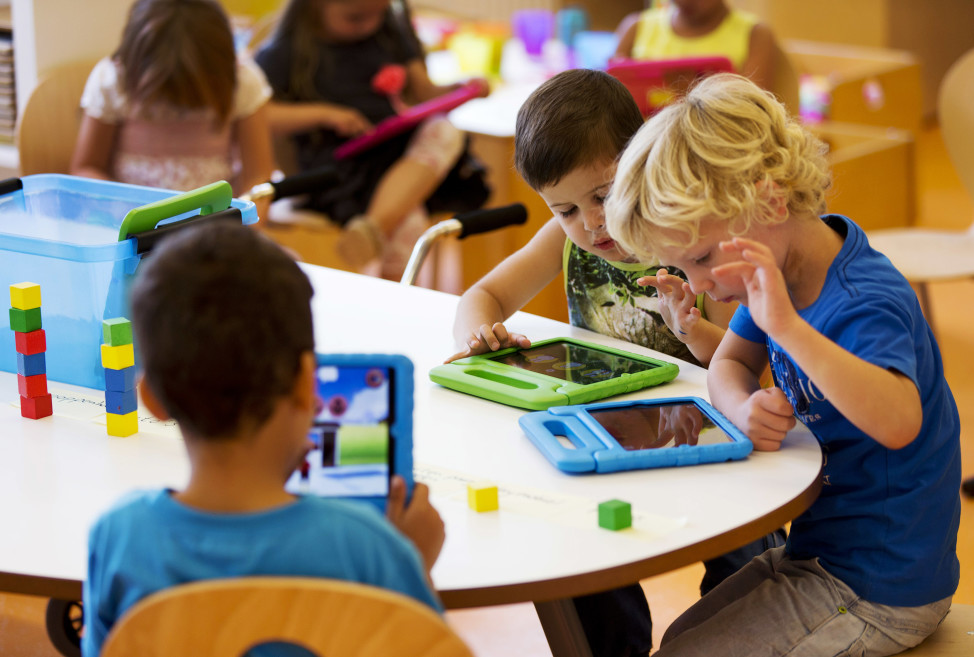 FILE - Children play with their iPads at the Steve Jobs school Sneek, the Netherlands. (Reuters)