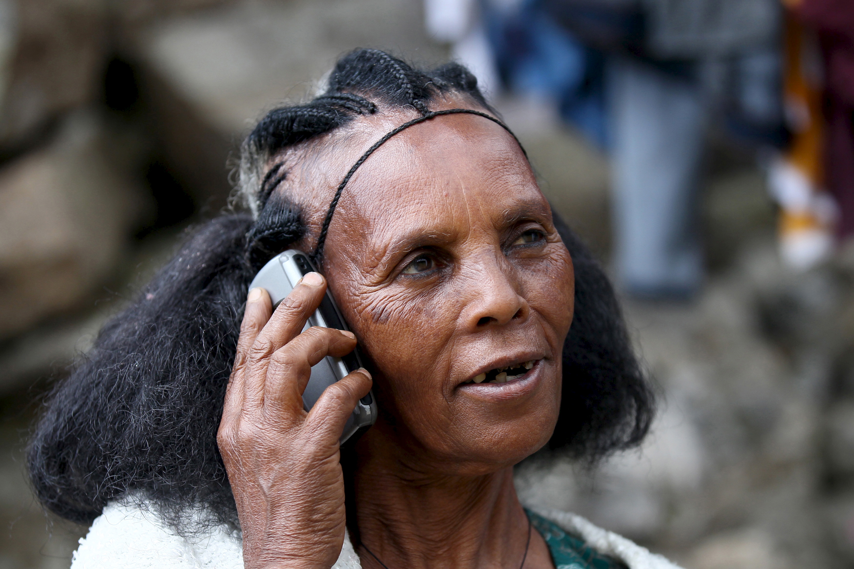 A woman makes a call on her mobile phone in Ethiopia's capital, Addis Ababa, Nov. 9, 2015. Ethiopia's state-run telecoms monopoly will launch a tender in December or January to help the company upgrade infrastructure and expand its mobile phone coverage by about 72 percent, the company's chief executive said. (Reuters)