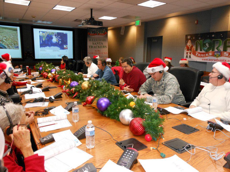 Volunteers at NORAD's Operations Center take calls from people interested in tracking Santa during his 2014 Christmas travels. (NORAD Public Affairs)