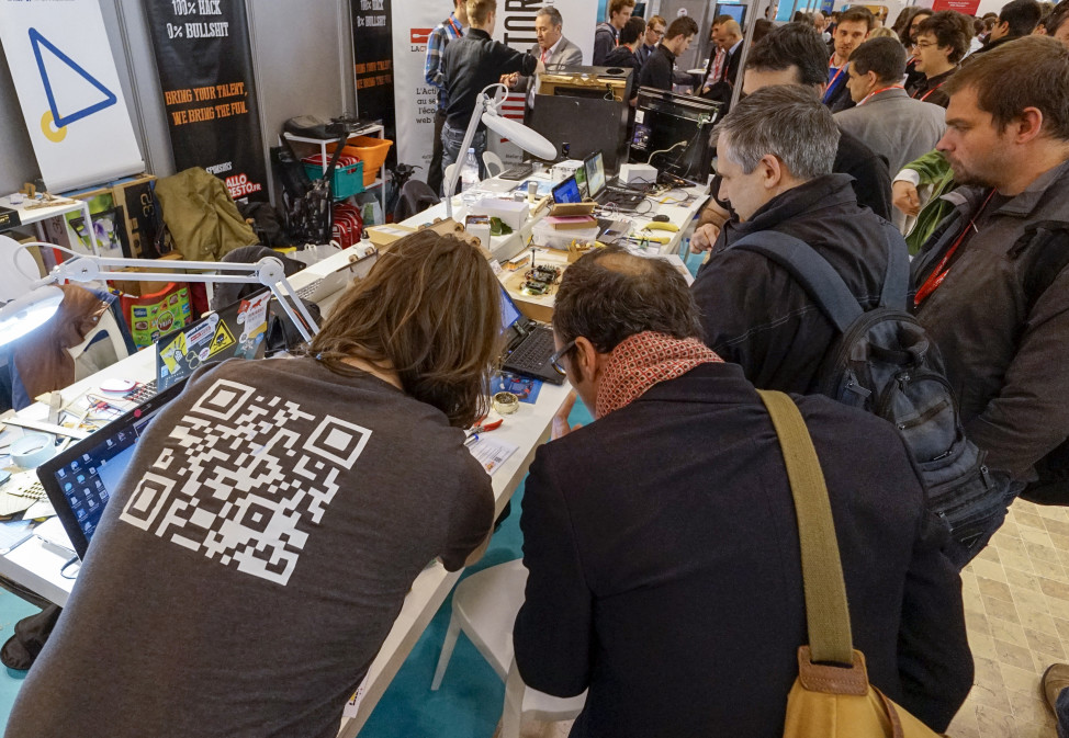 FILE - Visitors at the SIdO Connected Business trade show, an event dedicated to the Internet of Things (IoT), look at displayed products, Lyon, France. (Reuters)  
