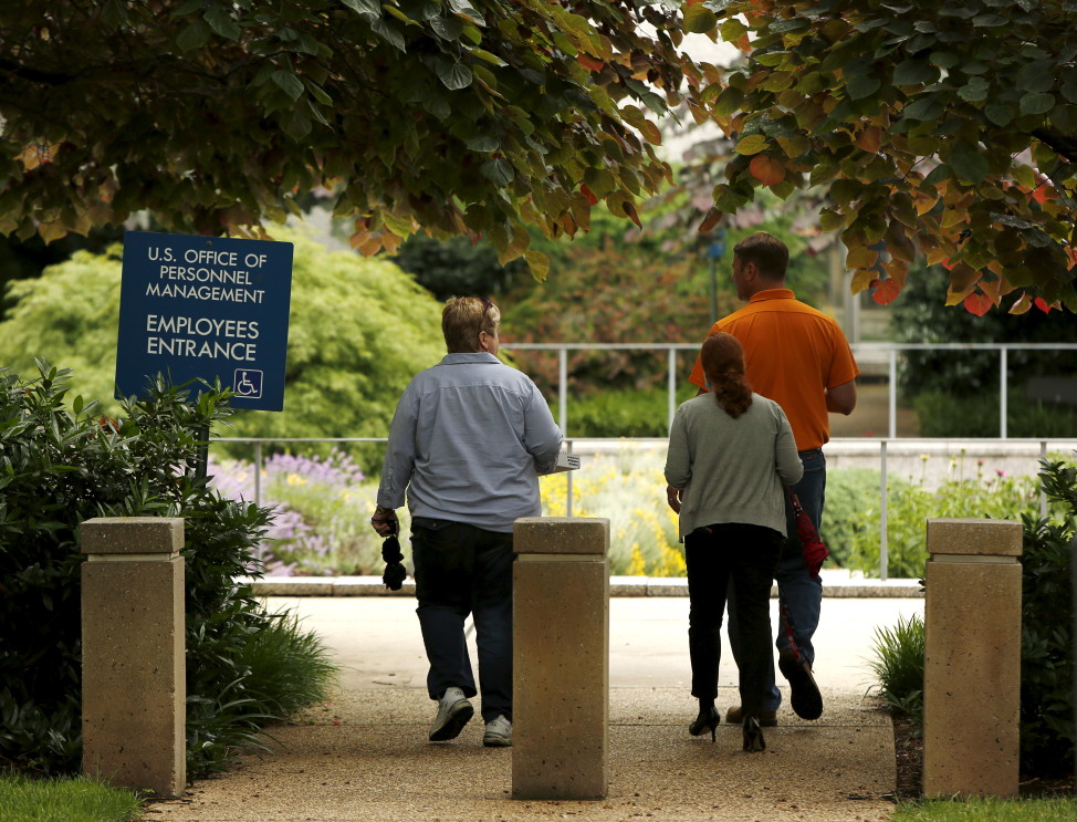 Employees of the U.S. Office of Personnel Management  (OPM) return to their building during lunch in Washington, June 5, 2015. In the latest in a string of intrusions into U.S. agencies' high-tech systems, OPM suffered what appeared to be one of the largest breaches of information ever on government workers. (Reuters)