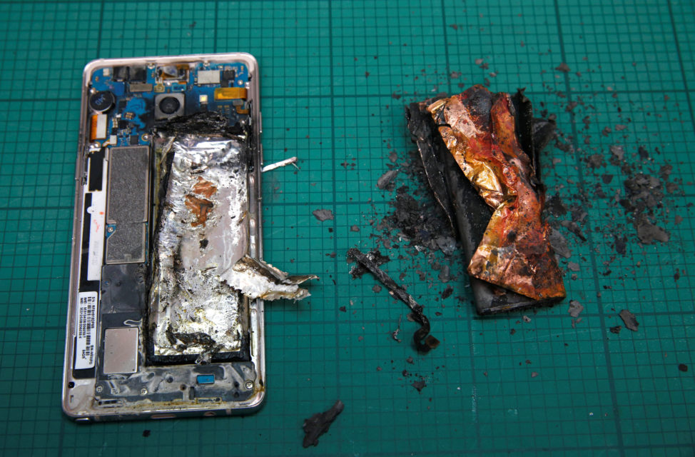 A Samsung Note 7 handset is pictured next to its charred battery after catching fire during a test at the Applied Energy Hub battery laboratory in Singapore Oct. 5, 2016. (Reuters)
