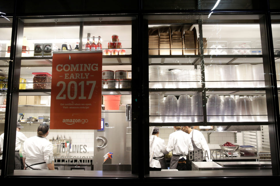 FILE - Kitchen staff are seen inside Amazon Go's brick-and-mortar grocery store without lines or checkout counters, in Seattle Washington, Dec. 5, 2016. (Reuters) 