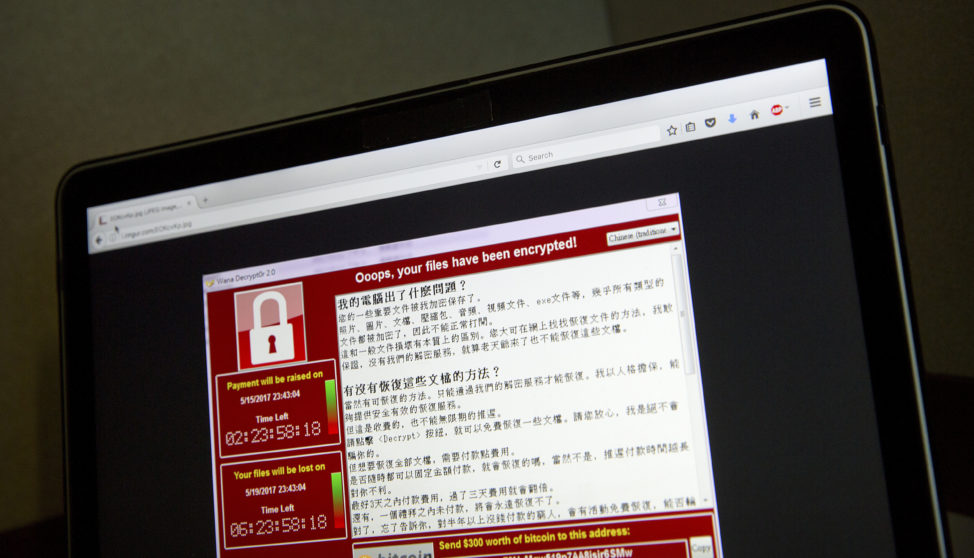 A screenshot of the warning screen from a purported ransomware attack, as captured by a computer user in Taiwan, is seen on laptop in Beijing, China, May 13, 2017. (AP)