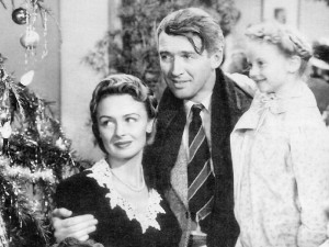 James Stewart as George Bailey — with Donna Reed as his wife, Mary, and Karolyn Grimes as his youngest child, Zulu — still looks frazzled, despite the happy ending to “It’s a Wonderful Life.”  (Seneca Falls It’s a Wonderful Life Museum)