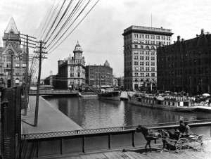 A horsecart passes over the much more successful Erie Canal in Syracuse, New York, about 1900.  (Library of Congress)