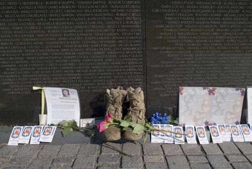 Many decades after the conclusion of the Vietnam War, people are still leaving small tributes at the Vietnam Veterans Memorial.  (Carol M. Highsmith)