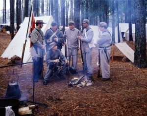 Civil War re-enactments like this one in North Carolina certainly honor the courage of the soldiers on both sides.  These “Confederates” gather beside a campfire.  (Carol M. Highsmith)