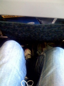 Just crossing your legs in a middle seat is out of the question.  You might never be able to uncross them. (schatz, Flickr Creative Commons)