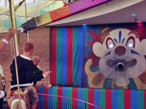 That four-color chute at the top is dispensing rings — mostly iron, some brass — to carousel riders in Santa Cruz, California.  (Bradley P. Johnson, Wikipedia Commons)