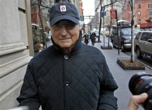 Convicted investment swindler Bernard Madoff managed a thin smile here, but certainly made a lot of other people mighty UNhappy.  (Jason De Crow/AP)