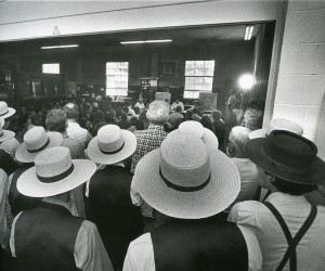 Amishmen listen in on a meeting about a proposed subdivision of a local farm into hundreds of housing plots.  (Free Library of Philadelphia)