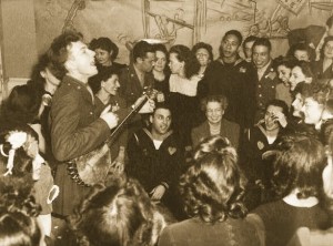 Pete Seeger, entertaining First Lady Eleanor Roosevelt and others at a labor canteen in 1944.  (Library of Congress)