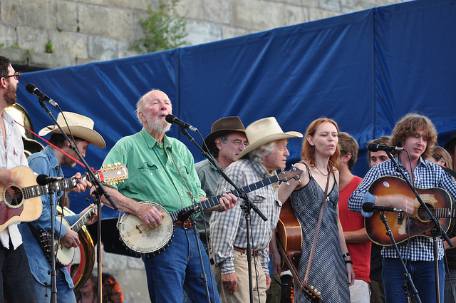 You get the spirit here, as Pete Seeger leads the ensemble at the Newport Folk Festival, which he helped found. (SWIMPHOTO, Flickr Creative Commons)
