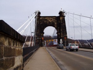 The Wheeling Suspension Bridge, over which The National Road still runs, looks its age, for sure. (Chris Light, Wikipedia Commons)