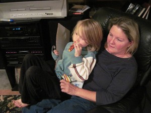 Grandma and grandson watch another child, who's being homeschooled, draw.  (kellyhogaboom, Flickr Creative Commons)