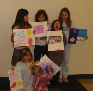 Homeschooled students, who might or might not be from one family, show off sketches they drew after learning about flags.  (mia3mom, Flickr Creative Commons)