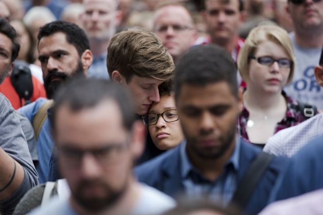 People gather for a vigil in memory of the victims of the Orlando, Fla., worst mass shooting in modern U.S. history, Monday, June 13, 2016, at City Hall in Philadelphia. A gunman opened fire inside a crowded gay nightclub early Sunday, before dying in a gunfight with SWAT officers, police said. (AP Photo/Matt Rourke)