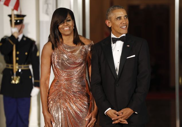 President Barack Obama and first lady Michelle Obama waits to greet Italian Prime Minister Matteo Renzi and his wife Agnese Landini on the North Portico for a State Dinner at the White House in Washington, Tuesday, Oct. 18, 2016. (AP Photo/Pablo Martinez Monsivais)