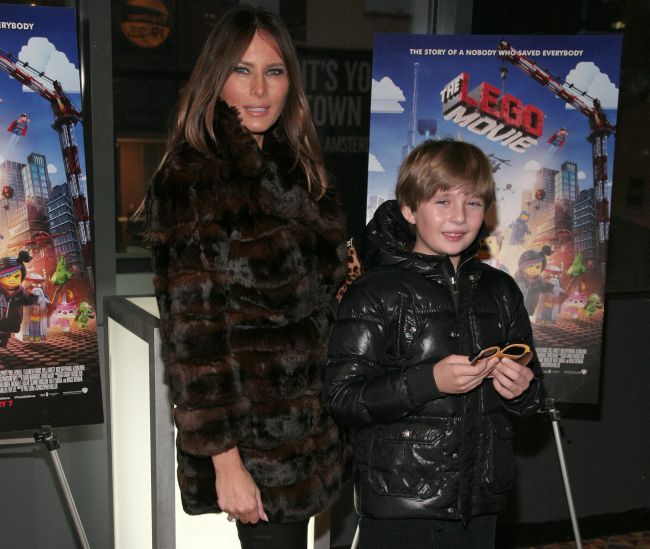 Melania Trump, left, and her son Barron William Trump, right, attend a screening of "The Lego Movie" hosted by Warner Bros. Pictures and Village Roadshow Pictures on Wednesday, Feb. 5, 2014 in New York. (Photo by Andy Kropa/Invision/AP)