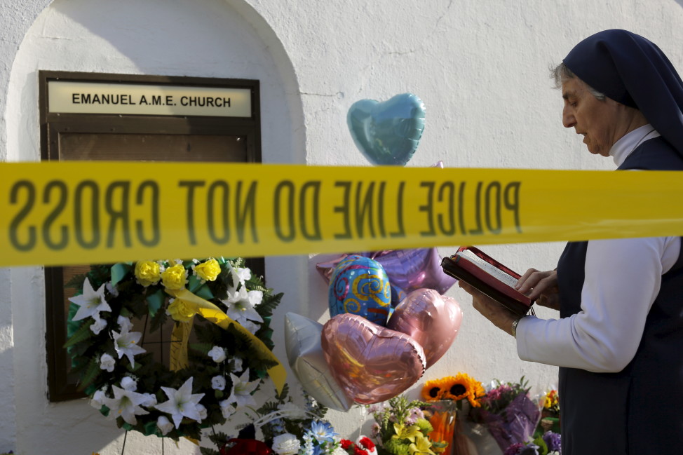 Sister Mary Thecla  prays outside the Emanuel African Methodist Episcopal Church in Charleston, South Carolina on June 19, 2015, two days after a mass shooting at the church left nine dead. (Reuters)