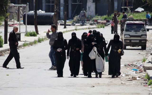 Female medical nurse activists tour the streets of Aleppo's rebel-controlled areas during a polio vaccine campaign. April 13, 2015. (REUTERS)