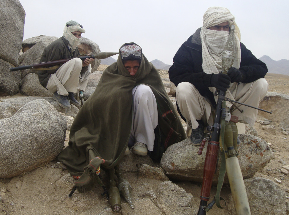 Taliban fighters pose with weapons in an undisclosed location in Afghanistan on Oct. 30, 2009. (Reuters)