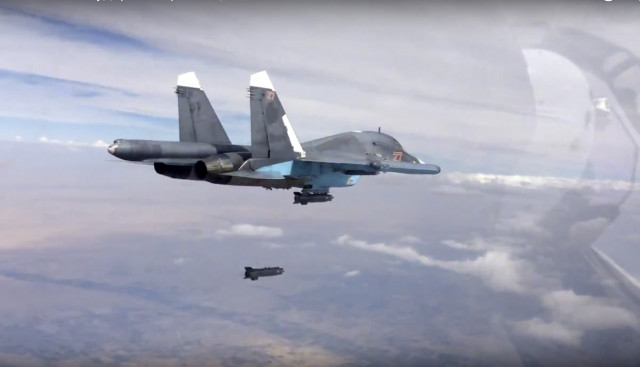 Russian Su-34 strike fighter drops a bomb over Syria October 9, 2015. (Russian Defense Ministry Press Service via AP)